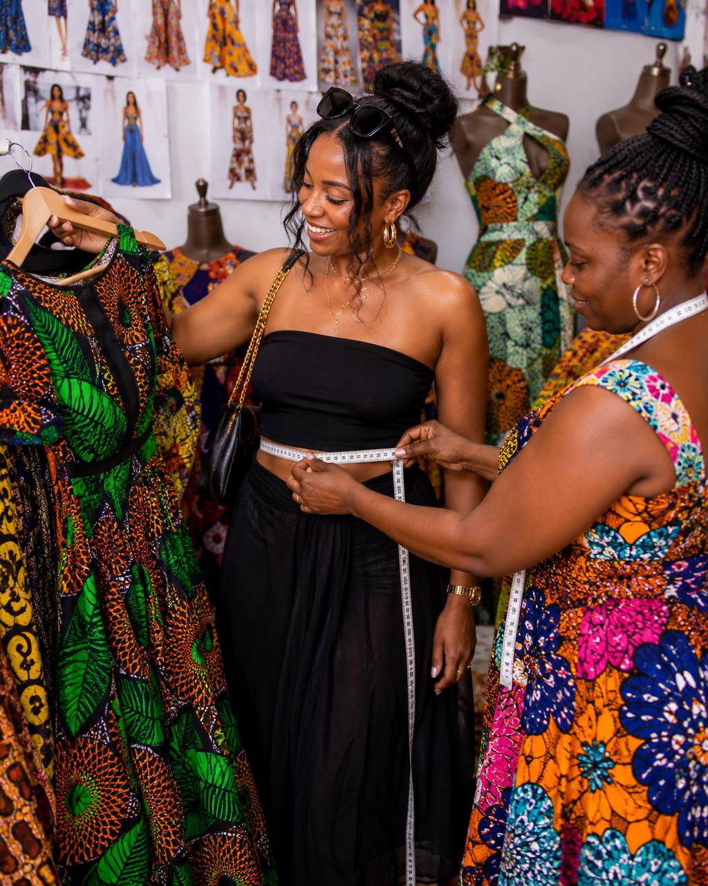 Client being measured and choosing designs during the Experience Ghana Design Tour